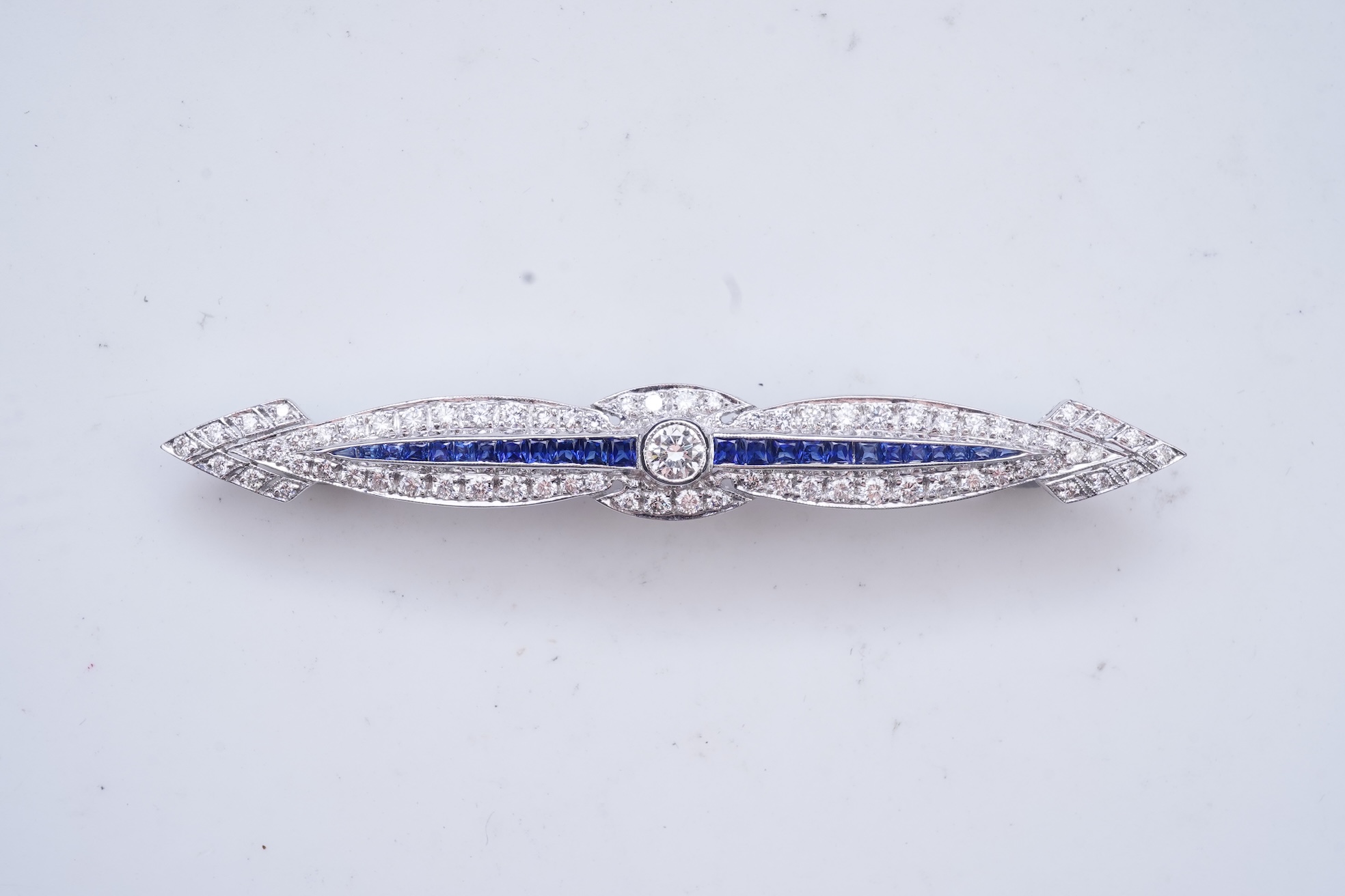A sapphire and diamond bar brooch